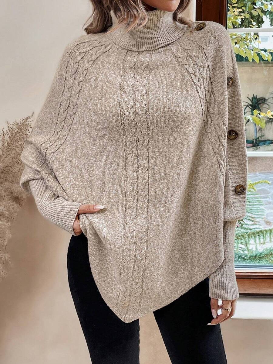 Alexis | Asymmetrisk kabelstrik-poncho med høj hals