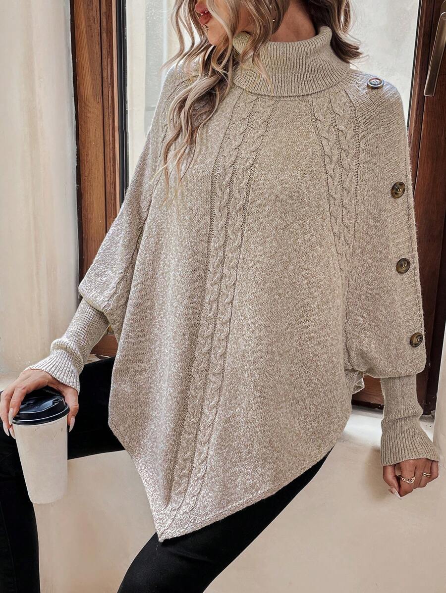 Alexis | Asymmetrisk kabelstrik-poncho med høj hals