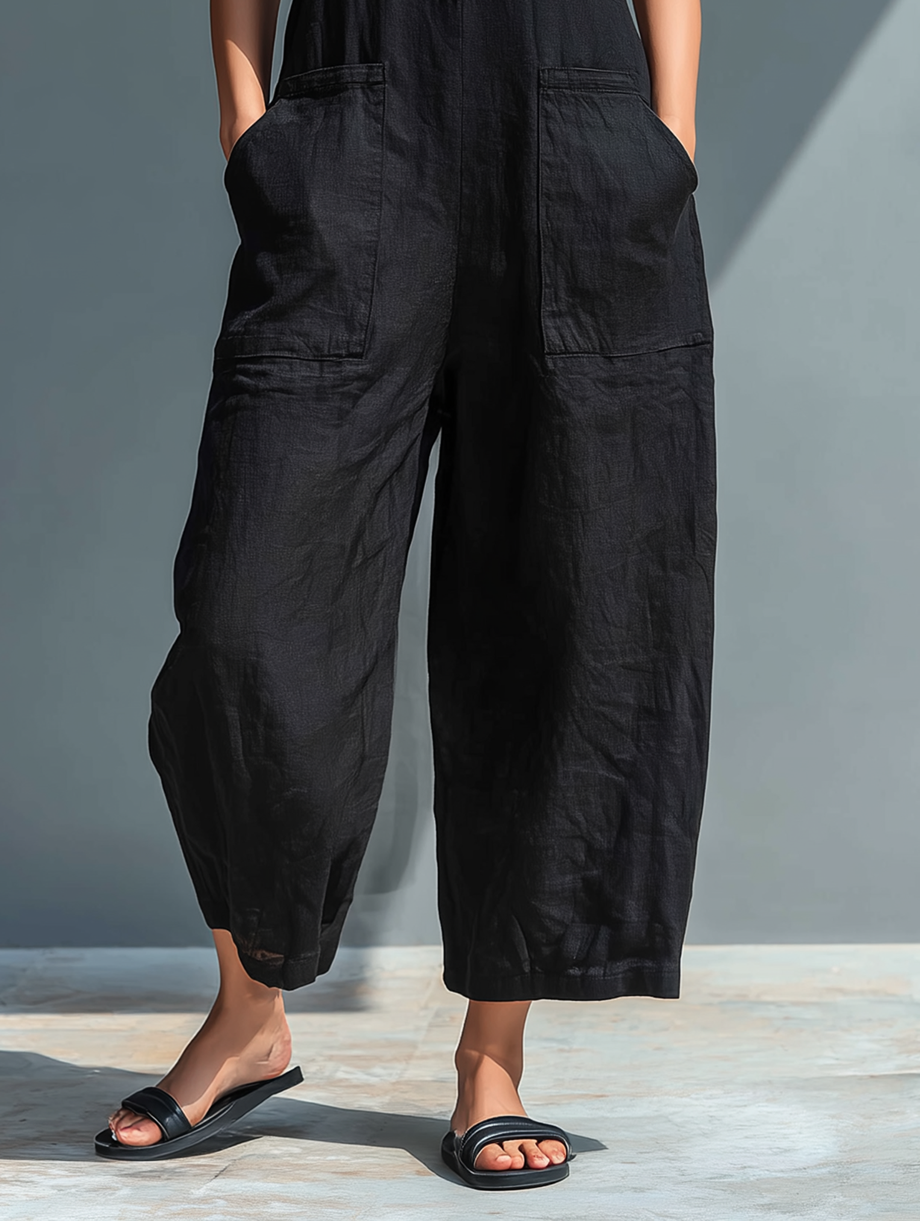 Mia | Ærmeløs jumpsuit med knaplukning